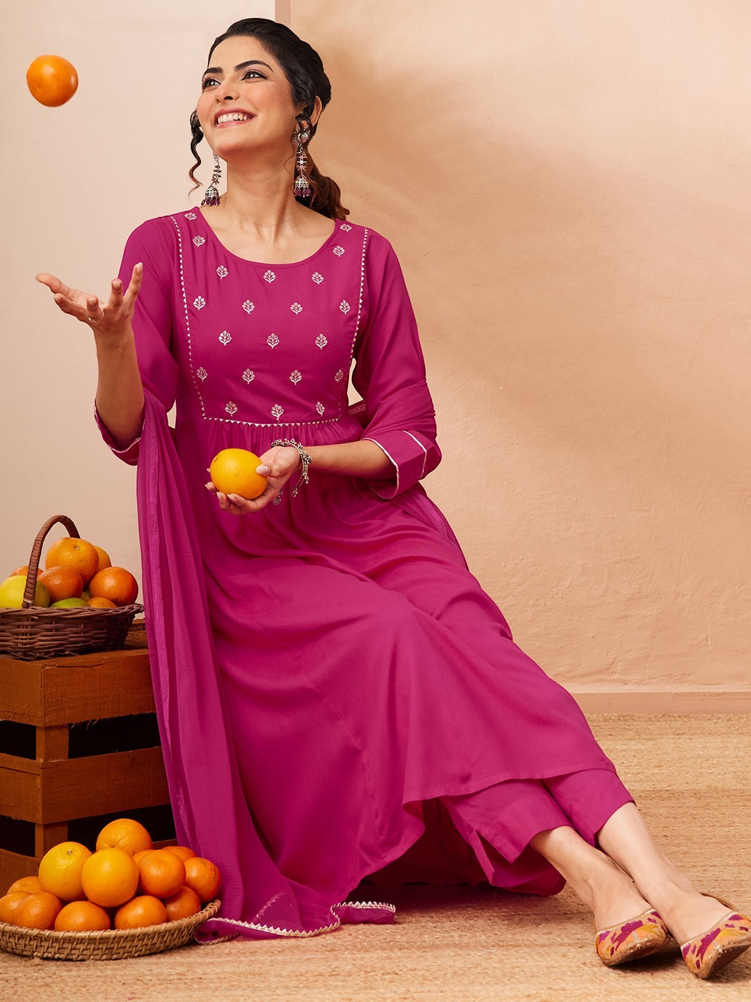 Naanu magenta Anarkali kurta set with white butti embroidery, lace trim, 3/4 sleeves, slim pants, and chiffon dupatta.