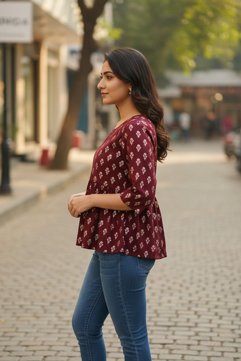 Naanu deep maroon burgundy georgette peplum top with white gold foil buti print and 3/4 sleeves.