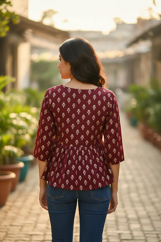 Naanu deep maroon burgundy georgette peplum top with white gold foil buti print and 3/4 sleeves.