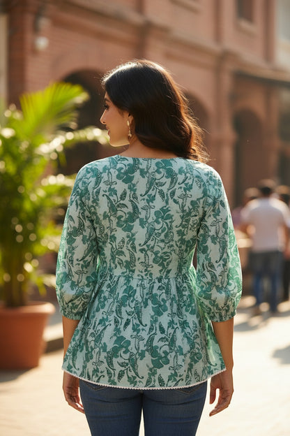 Naanu mint green cotton peplum top with teal botanical print, bishop sleeves, and lace trim.