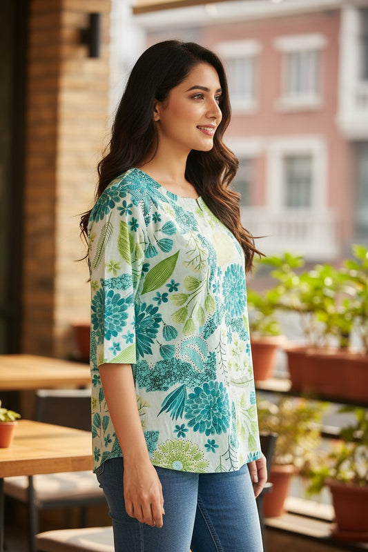 Naanu mint white cotton short top with bold teal green botanical floral print and keyhole neck, 3/4 sleeves.