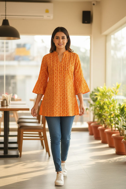 Naanu mustard orange cotton kurti with Bandhani diamond dot print, V-neck, and 3/4 bell sleeves.