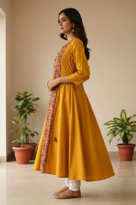 Naanu mustard yellow A-line kurta with burgundy floral center panel and 3/4 sleeves, worn by a model.
