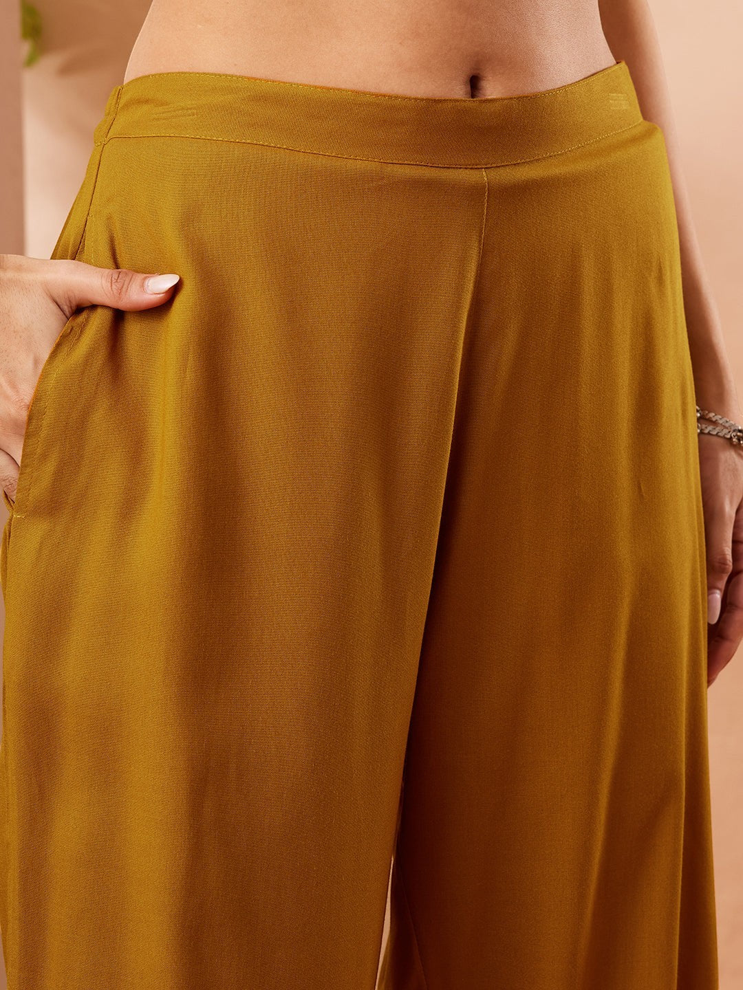 Naanu mustard yellow solid straight kurta palazzo and paisley dupatta set. Wide-leg palazzo pants with pockets.