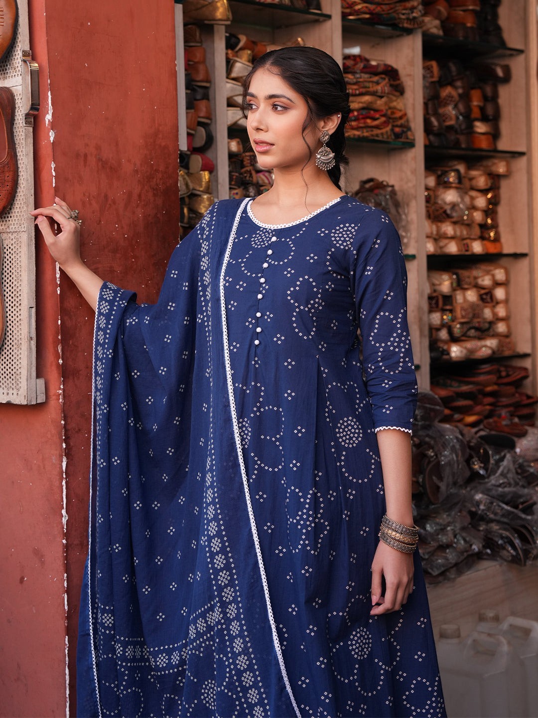 Naanu navy blue cotton-blend Anarkali kurta set with white bandhani dots, lace trim, and pearl buttons.