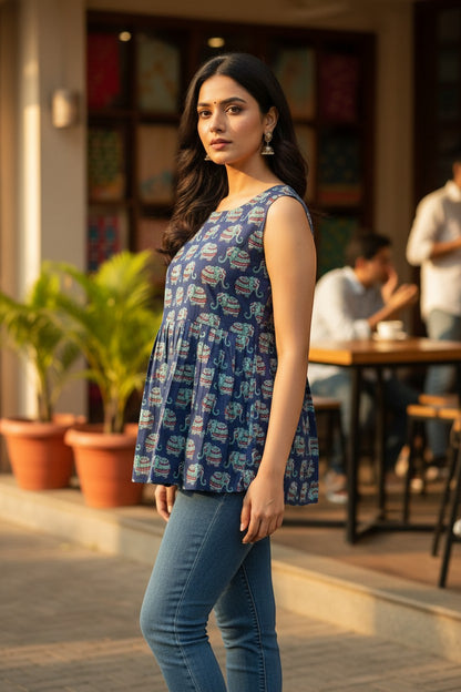 Naanu navy blue sleeveless cotton tunic with all-over decorative elephant print in teal, red, and white. Straight fit, square neck.