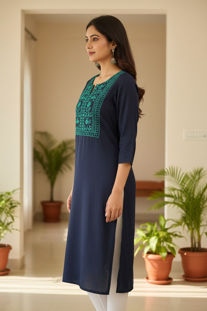Naanu navy blue cotton kurta with turquoise and teal floral vine embroidery on square yoke, half sleeves, and V-notch neckline.