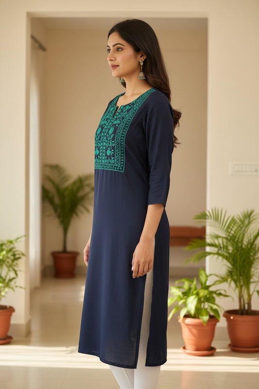 Naanu navy blue cotton kurta with turquoise and teal floral vine embroidery on square yoke, half sleeves, and V-notch neckline.