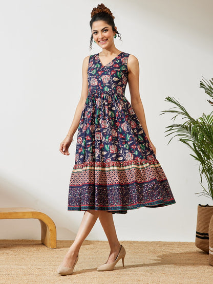 Naanu navy cotton midi dress with V-neck, empire waist, and tiered border hem featuring a Kalamkari floral print.
