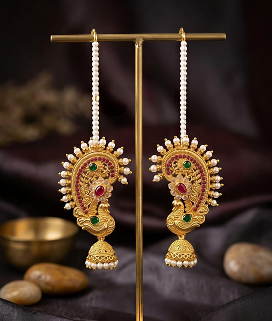 Naanu gold-toned peacock paisley jhumka earrings with pearl chain, ruby and emerald stones.
