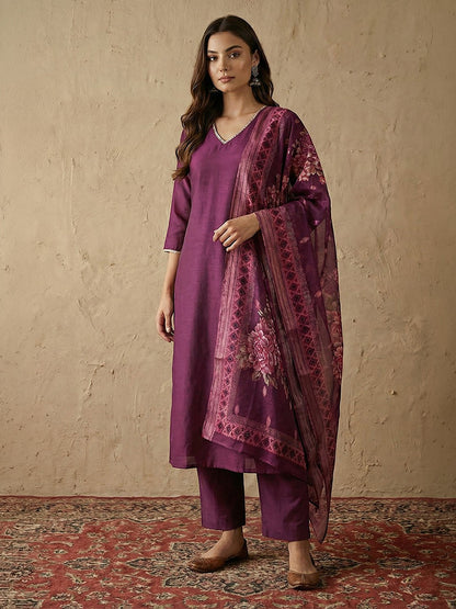 Naanu plum silk blend kurta set with V-neck, lace trim, and floral organza dupatta.