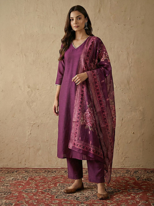 Naanu plum silk blend kurta set with V-neck, lace trim, and floral organza dupatta.