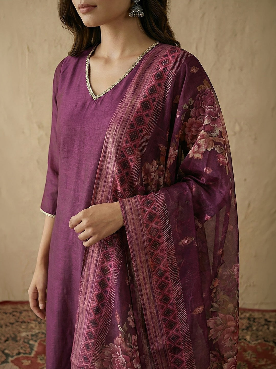 Naanu plum silk blend kurta with V-neck, lace trim, and floral organza dupatta.