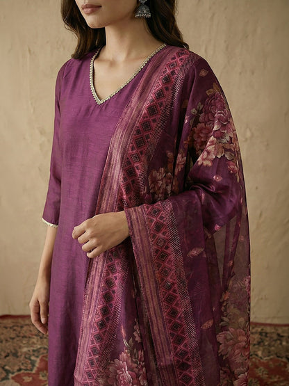 Naanu plum silk blend kurta with V-neck, lace trim, and floral organza dupatta.