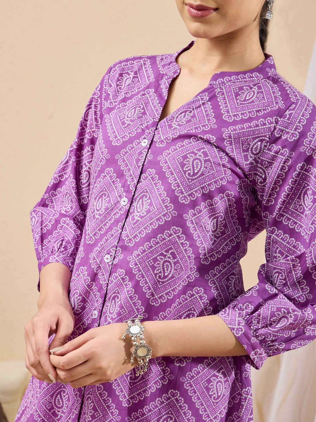 Naanu purple cotton tunic with white bandhani paisley print, mandarin collar, button-down front, and puff sleeves.