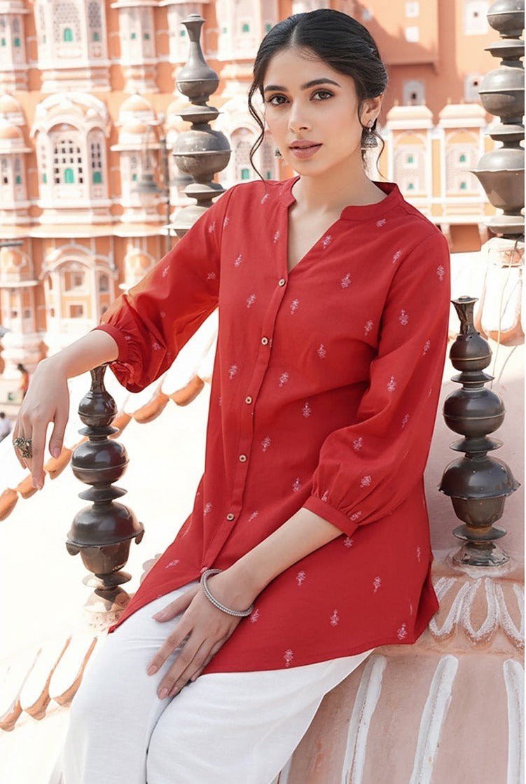 Naanu red cotton tunic with tonal butti print, Mandarin collar, button-down front, and 3/4 sleeves.