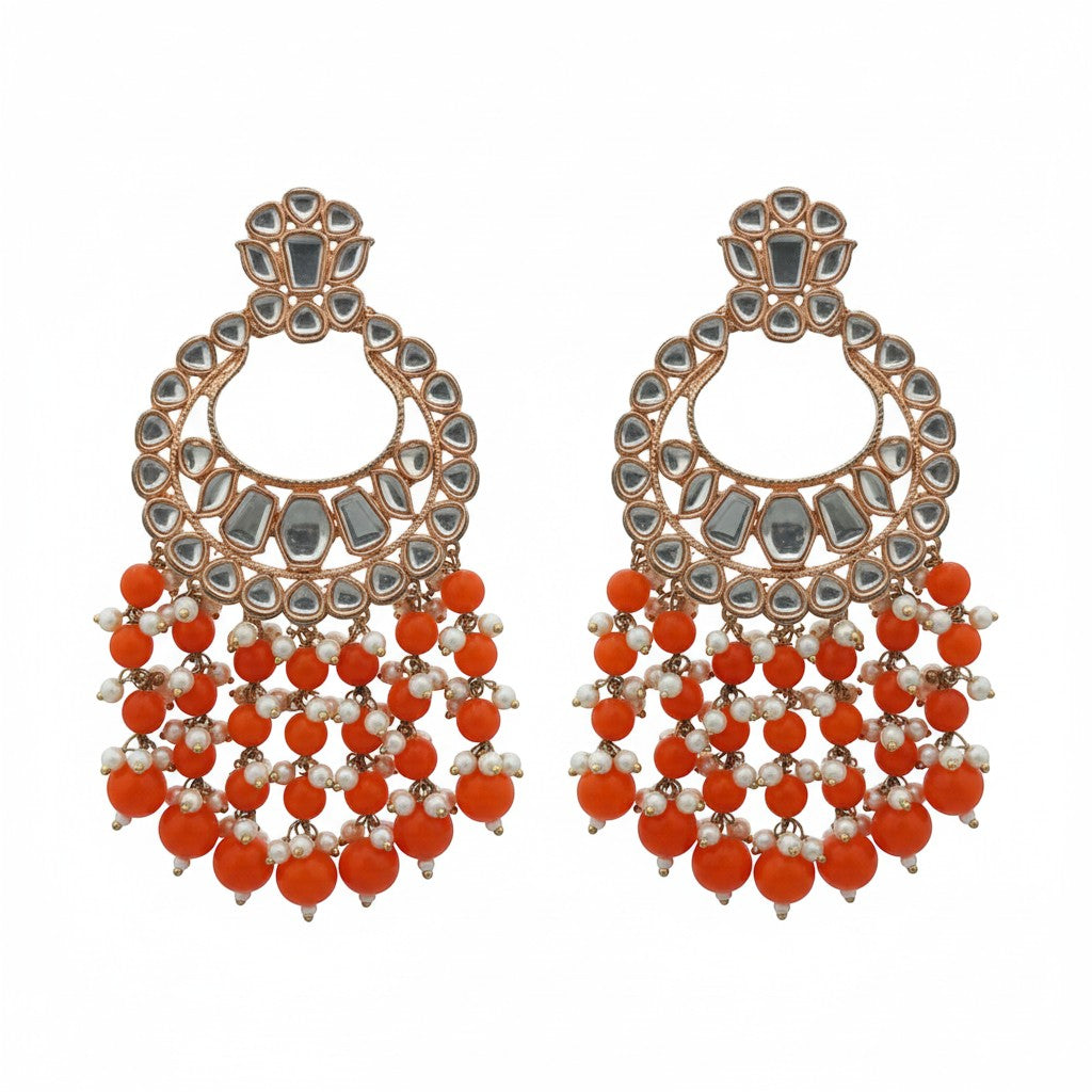 Naanu rose gold polki kundan chandbali earrings with orange coral bead fringe and white pearl accents.