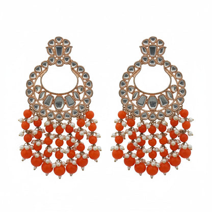 Naanu rose gold polki kundan chandbali earrings with orange coral bead fringe and white pearl accents.