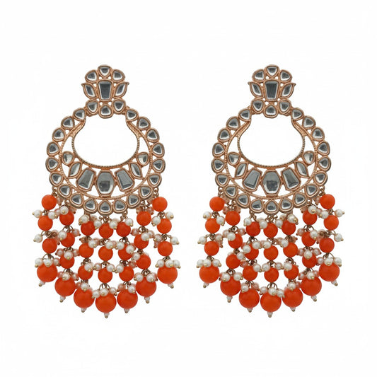 Naanu rose gold polki kundan chandbali earrings with orange coral bead fringe and white pearl accents.