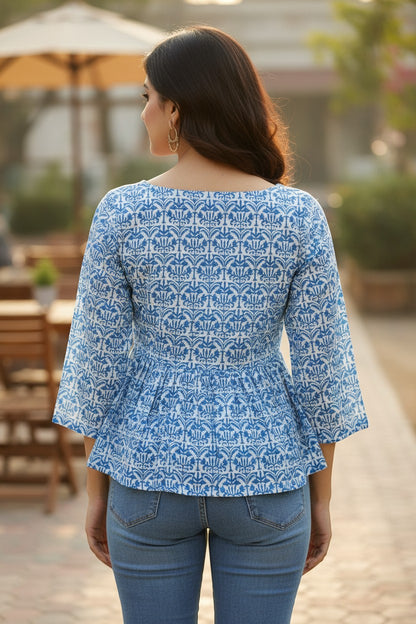 Naanu sky blue cotton peplum top with 3/4 sleeves and lotus damask block print, boat neckline.