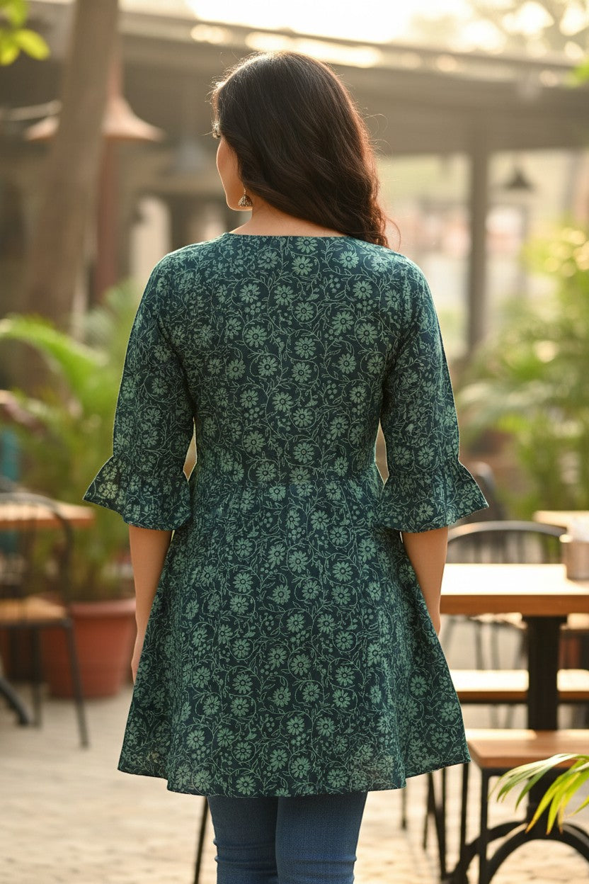 Naanu deep teal green cotton kurti with light teal floral vine jaal print, V-neck, 3/4 flared sleeves, and A-line silhouette.