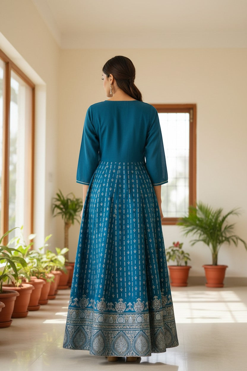 Naanu teal peacock blue A-line maxi kurta with gold geometric stripes and floral border, 3/4 sleeves.