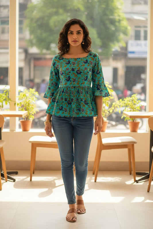 Naanu turquoise teal floral peplum top with 3/4 bell sleeves and square neck, made of 100% cotton.