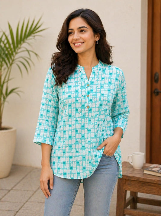 Naanu turquoise and white geometric block print 3/4 sleeve cotton kurti with V-neck and button placket.