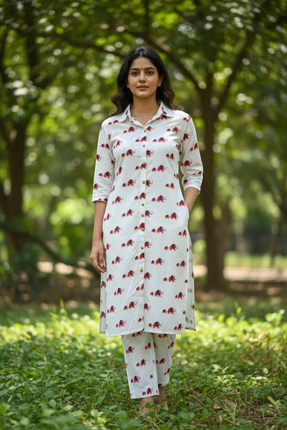 Naanu white cotton kurta and pants set with red elephant print, shirt collar, 3/4 sleeves, and straight hem.
