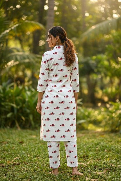 Naanu white cotton kurta and pants set with red elephant print, shirt collar, 3/4 sleeves, and straight hem.