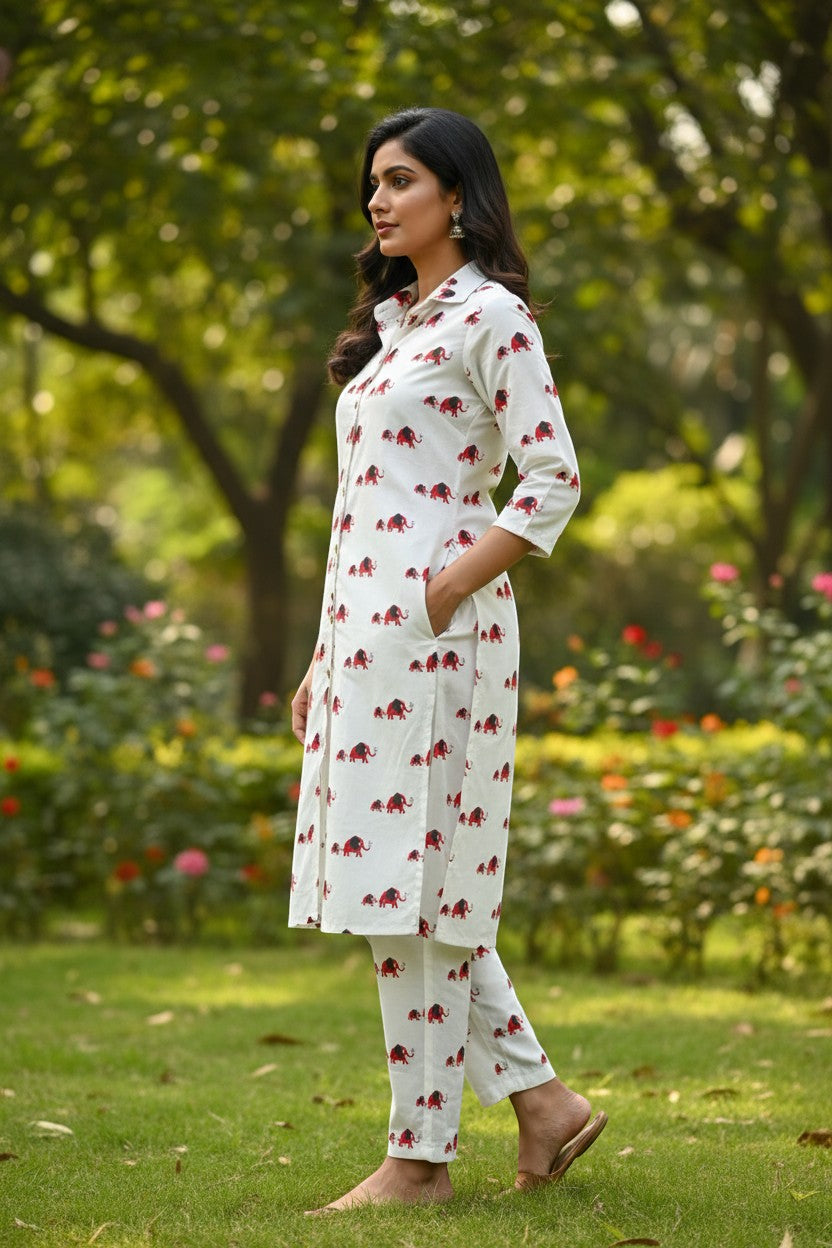 Naanu white cotton kurta and pants set with red elephant print, shirt collar, 3/4 sleeves, and straight hem.
