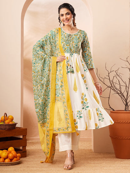 Naanu white and green floral block print Anarkali kurta set with yellow dupatta. Cotton, 3/4 sleeves, tiered ruffle hem.