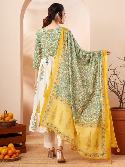 Naanu white and green floral block print Anarkali kurta set with yellow dupatta. Cotton, 3/4 sleeves, tiered hem, round neck.