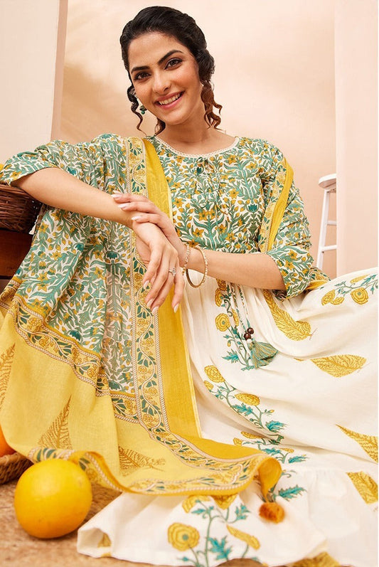 Naanu white and green floral block print Anarkali kurta set with yellow dupatta. Cotton, 3/4 sleeves, round neck, tiered hem.