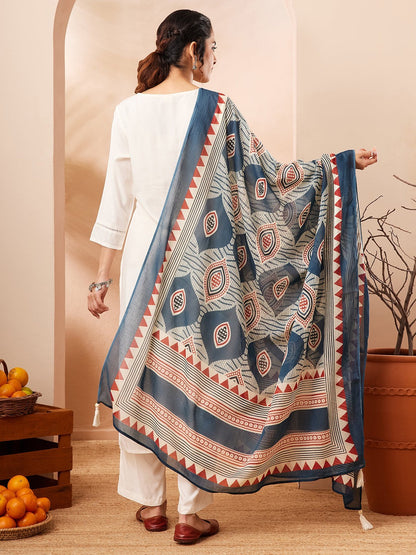 Naanu white rayon kurta set with wide-leg palazzo pants and a navy Ajrakh-print dupatta with ivory and rust accents.