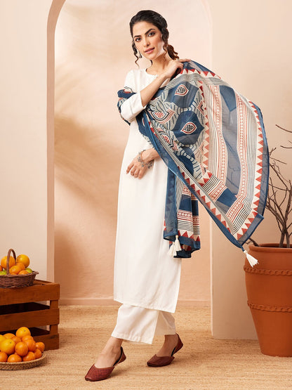 Naanu white rayon straight kurta set with 3/4 sleeves and lace hem, paired with wide-leg palazzo pants and a navy Ajrakh-print dupatta.