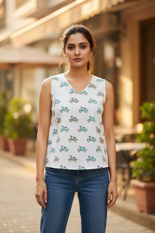 Naanu white sleeveless V-neck cotton top with teal and grey scooter print. Relaxed fit, perfect for casual wear.