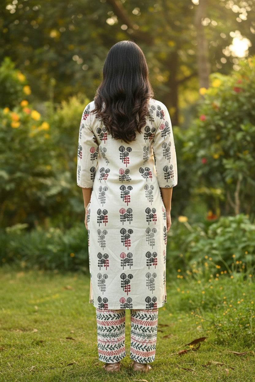 Naanu white cotton kurta set with tree block print, red buttons, and vine leaf pants.