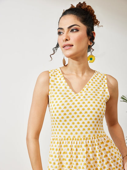 Naanu yellow butti print sleeveless V-neck cotton midi dress with tiered hem and pockets.