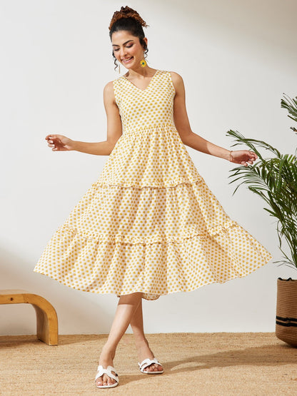 Naanu yellow butti print cotton midi dress with V-neck, empire waist, and double ruffle tiered hem.