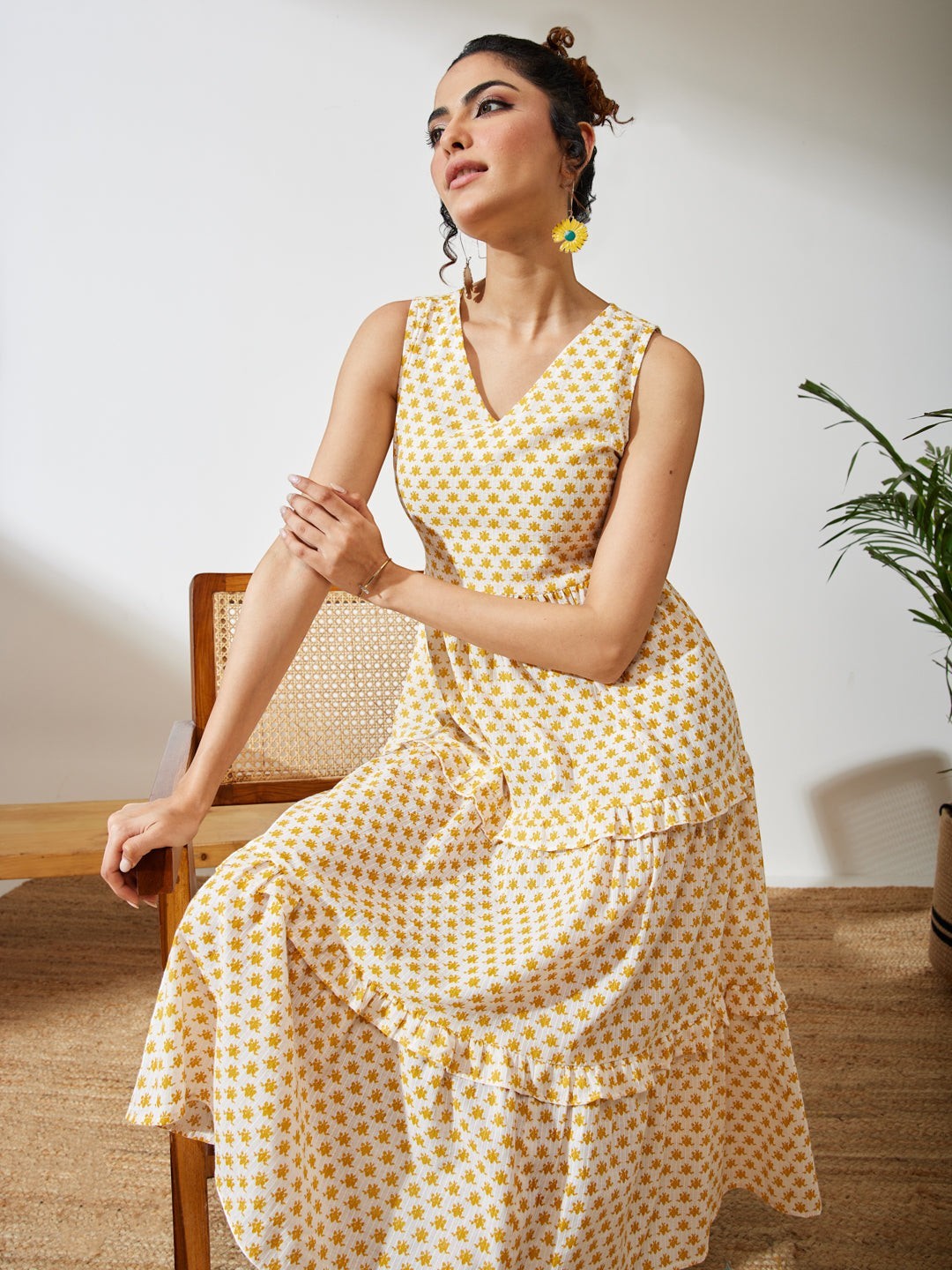 Naanu yellow butti print cotton midi dress with V-neck, empire waist, and double ruffle tiered hem.